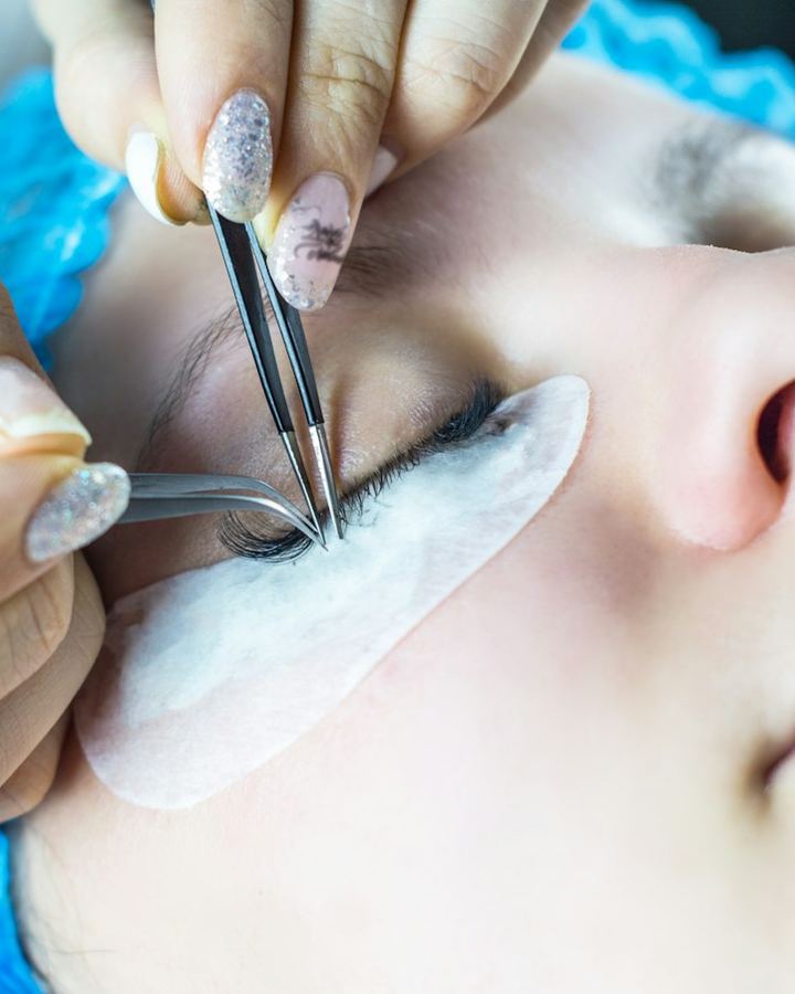 Brow artist working on a client